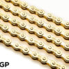 5 gold Izumi Chain 410GP are shown laid out on a white surface