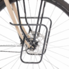 A Pelago Lowrider Pannier Support is shown as a close up of a front bicycle wheel with a commuter rack already fitted to the axke