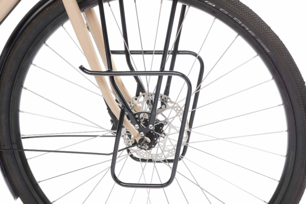 A Pelago Lowrider Pannier Support is shown as a close up of a front bicycle wheel with a commuter rack already fitted to the axke