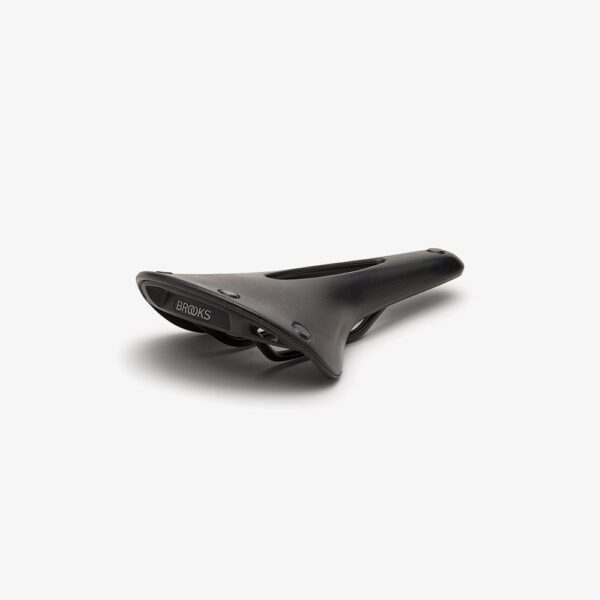 A black, rubber Brooks C17 Carved saddle is shown with black base plate and a central cut-out