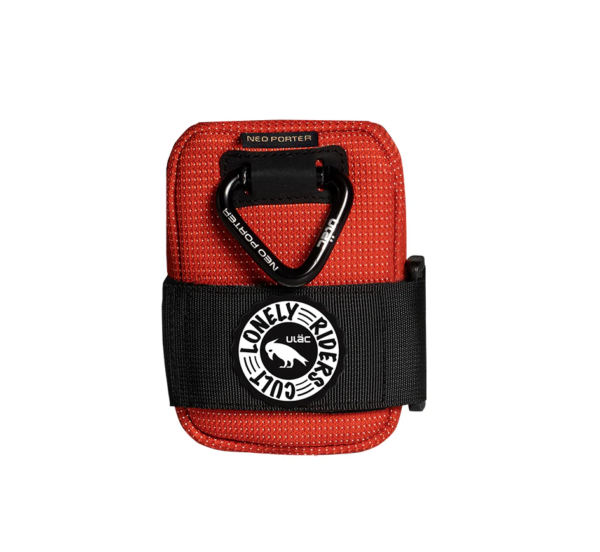 A small Ulac Radtail Verve bicycle saddle bag is shown in red lava colourway with a black carabiner on the front