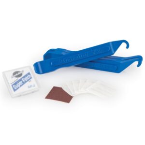 A Park Tool Tyre and Tube Repair Kit is shown as 3 bright blue nylon tyre levers & a se of pre-glued paches